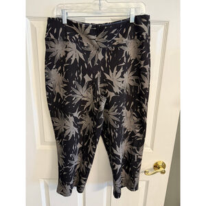 Women with Control Tummy Control Large Capri Pants with a leaf print.